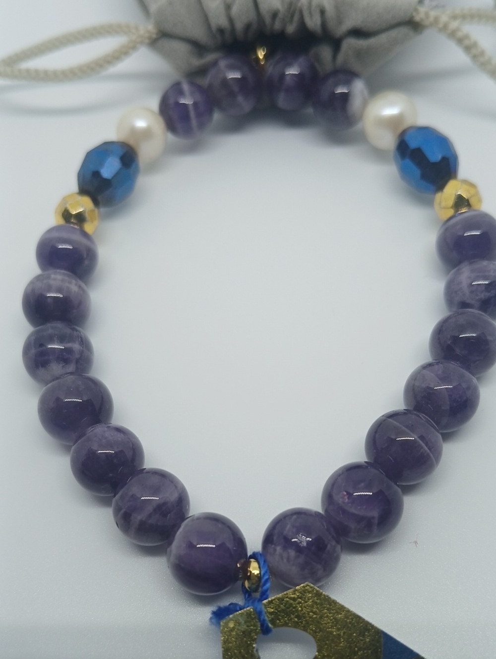 "Surprise Me" Amethyst Beaded Bracelet with Blue Crystal and Gold Accents